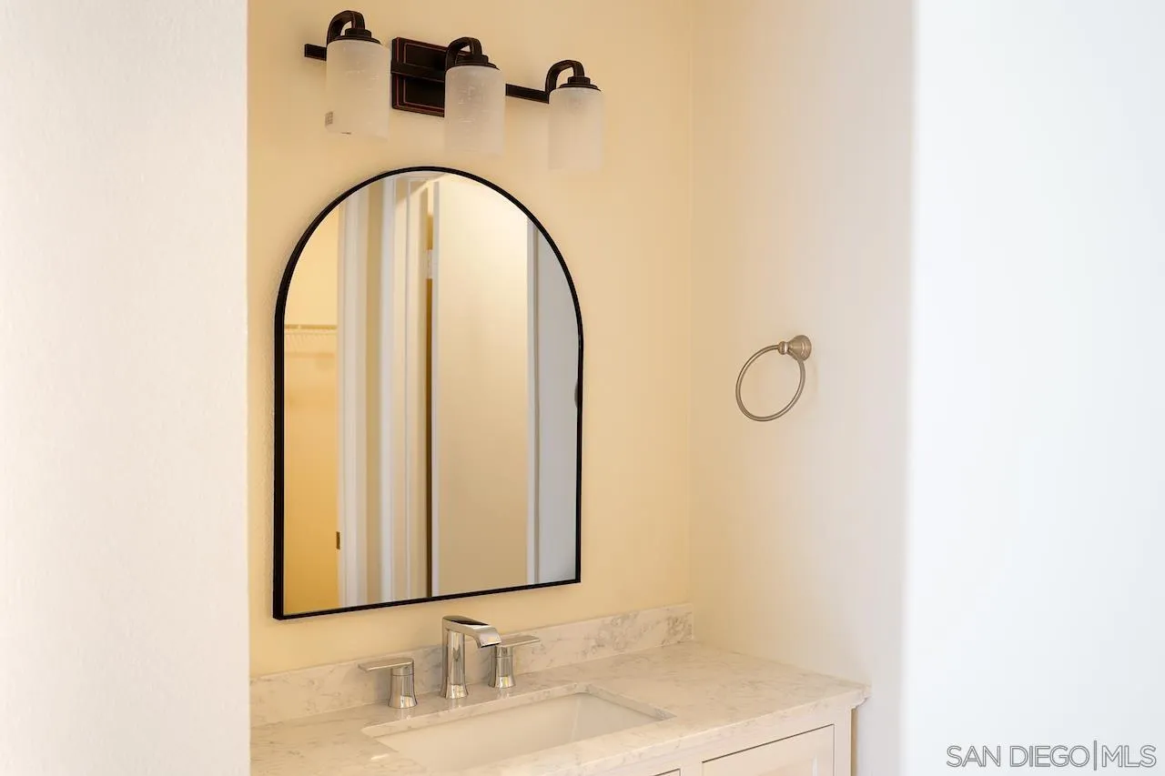17161 Alva Road, Unit 3125 San Diego, CA 92127 - Photo 27 of 29 a bathroom with a sink and a mirror