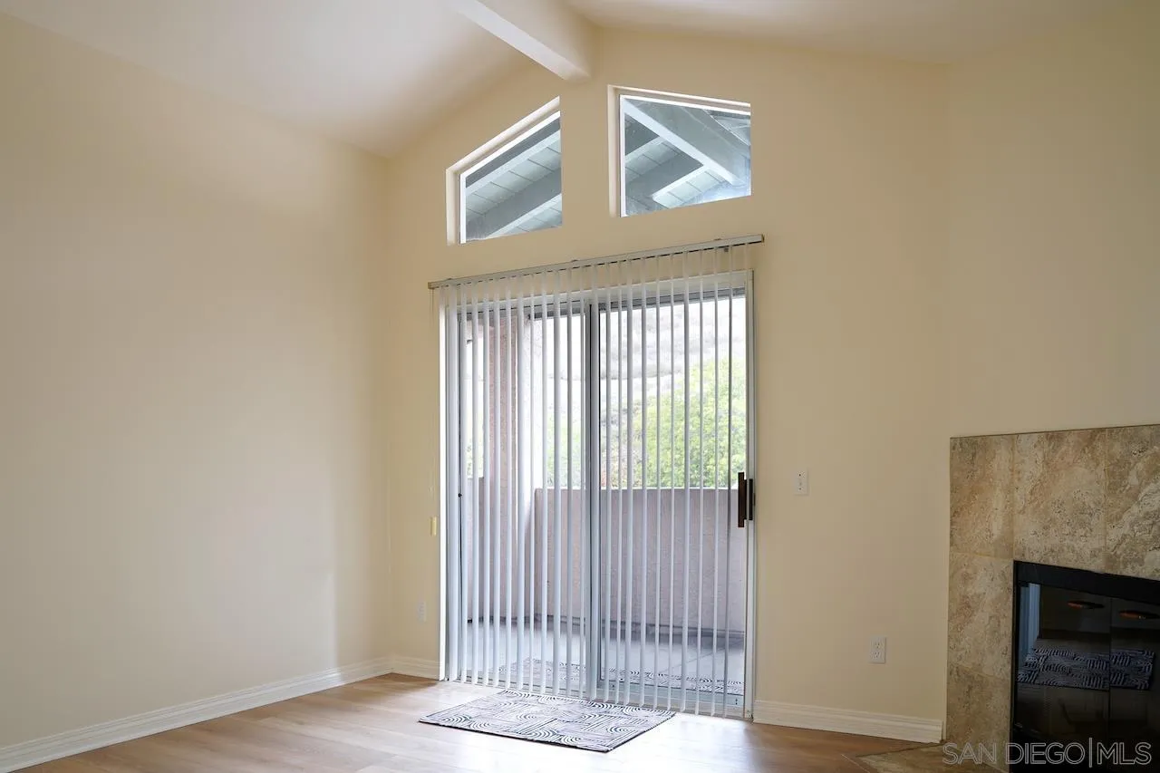 17161 Alva Road, Unit 3125 San Diego, CA 92127 - Photo 29 of 29 a view of a livingroom with wooden floor and a fireplace
