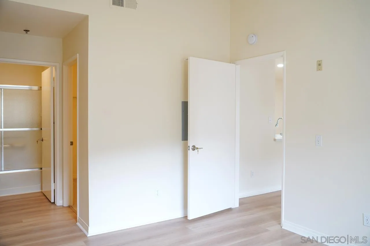 17161 Alva Road, Unit 3125 San Diego, CA 92127 - Photo 9 of 29 a view of a hallway with wooden floor