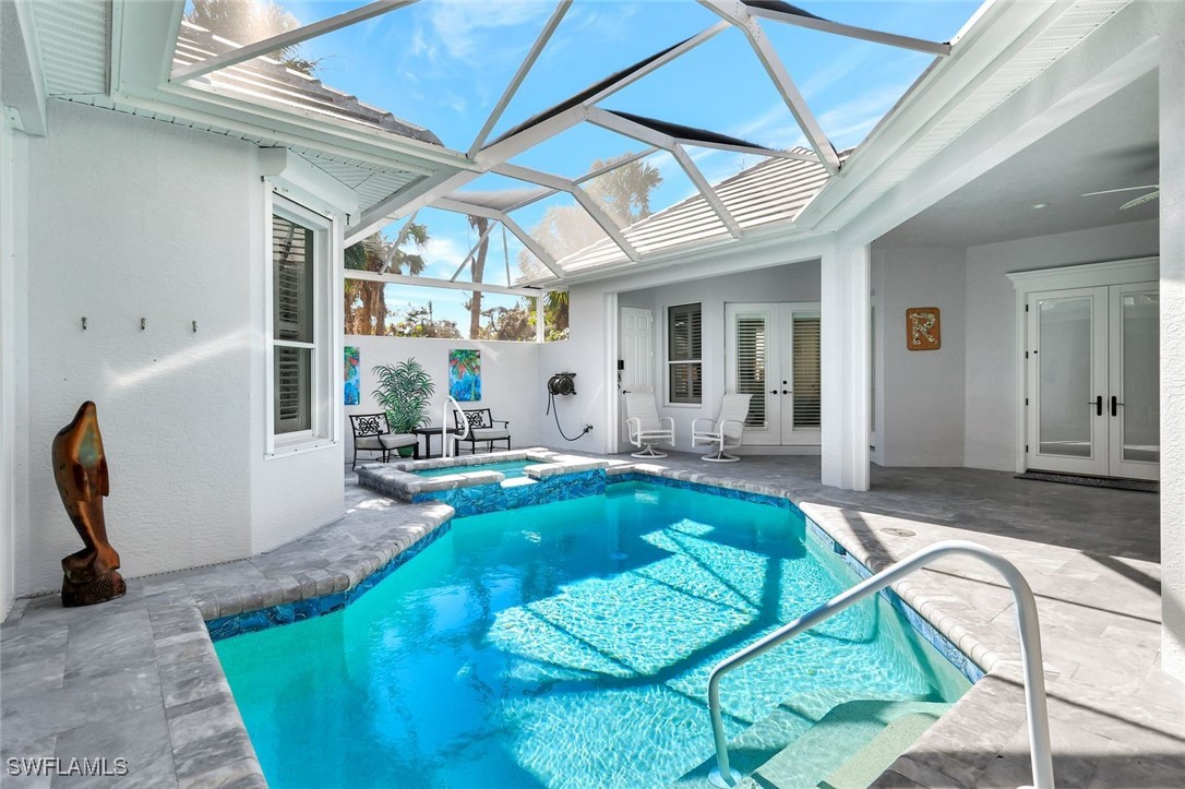 2450 Wulfert Road Sanibel, FL 33957 - Photo 6 of 44 a view of an entryway with a table and chairs