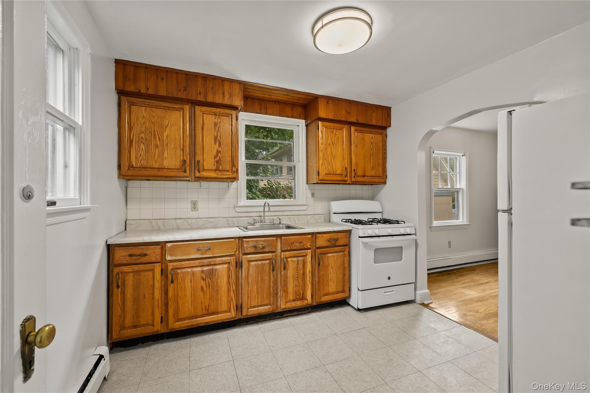 281-283 Old Haverstraw Road Congers, NY 10920 - Photo 9 of 41 a kitchen with stainless steel appliances granite countertop a sink and a refrigerator