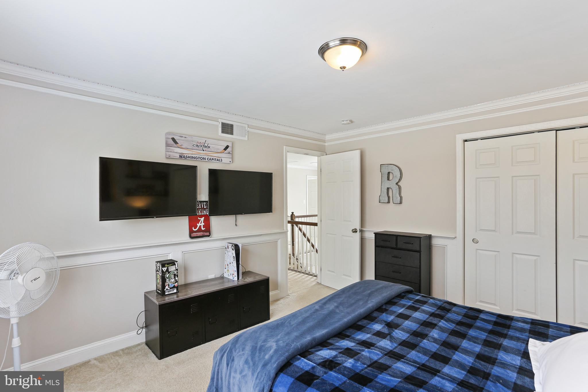 3234 Bidle Road Middletown, MD 21769 - Photo 26 of 45 a bedroom with a bed and a flat screen tv