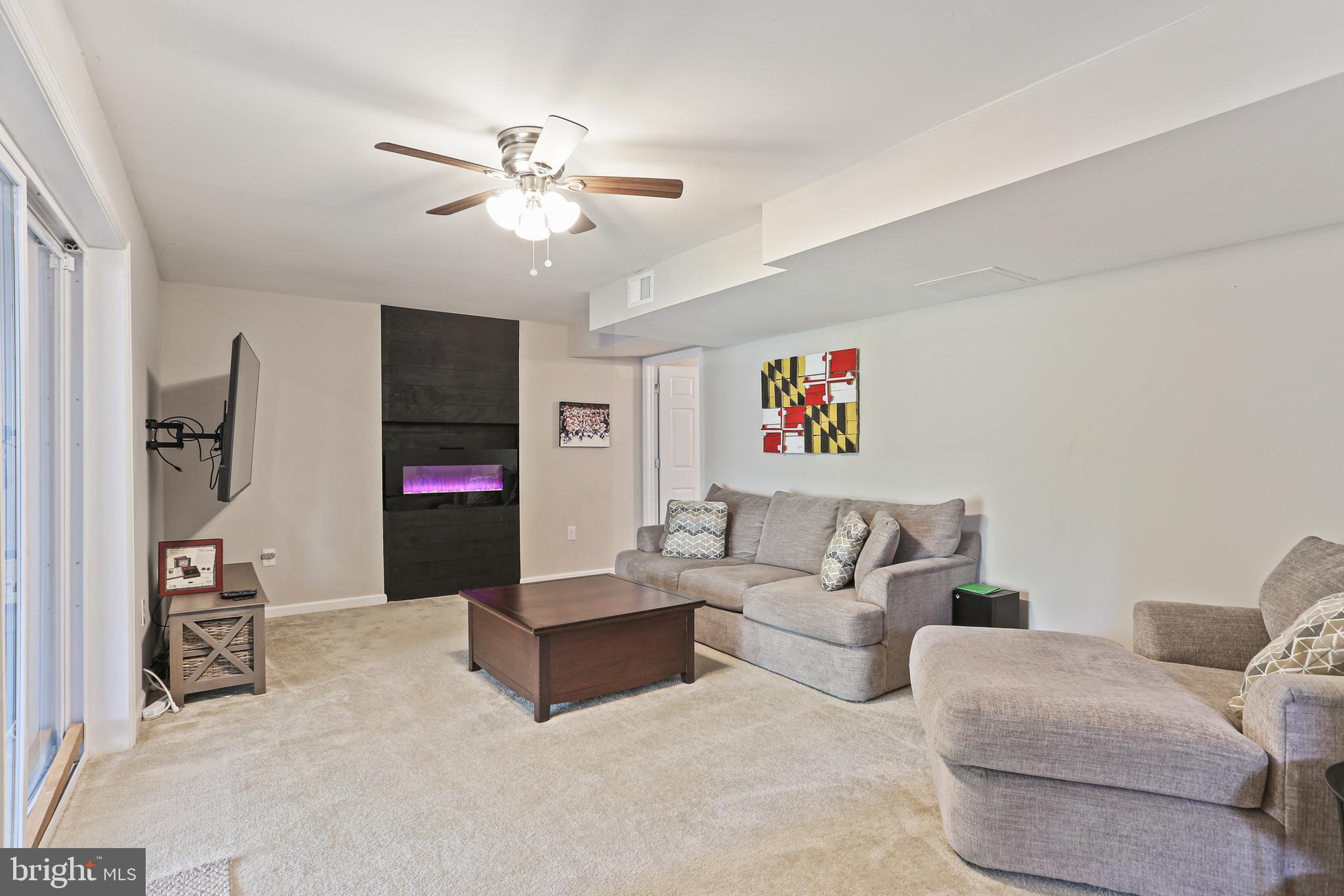 3234 Bidle Road Middletown, MD 21769 - Photo 33 of 45 a living room with furniture and a flat screen tv