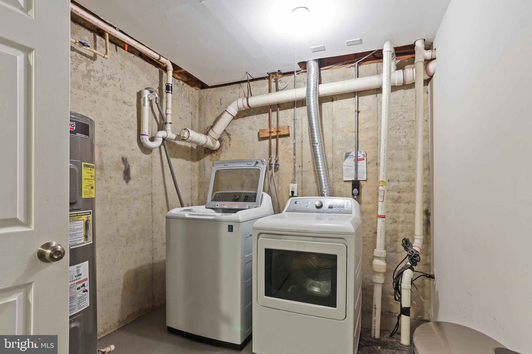 3234 Bidle Road Middletown, MD 21769 - Photo 38 of 45 a view of a storage & utility room with dryer and washer