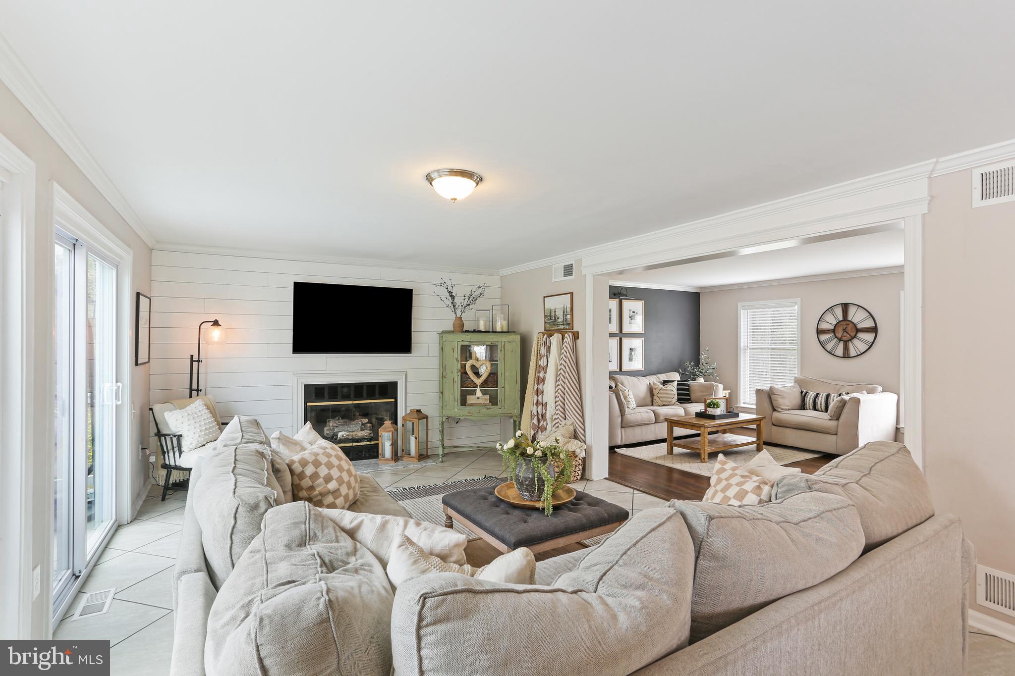 3234 Bidle Road Middletown, MD 21769 - Photo 9 of 45 a living room with fireplace furniture and a flat screen tv