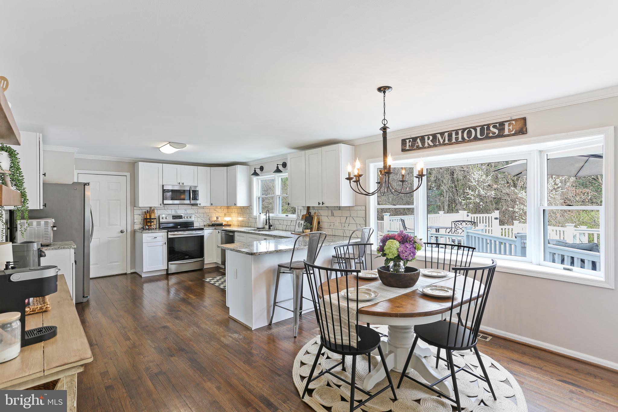 3234 Bidle Road Middletown, MD 21769 - Photo 10 of 45 a view of a dining room with furniture window and wooden floor
