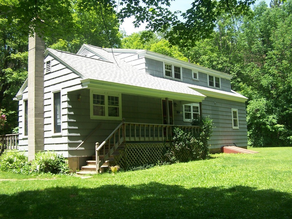 147 Hardwick Road Petersham, MA 01366 - Photo 4 of 13 a view of a house with a yard and a garden