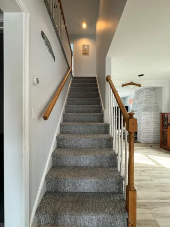 a view of a livingroom with furniture and window