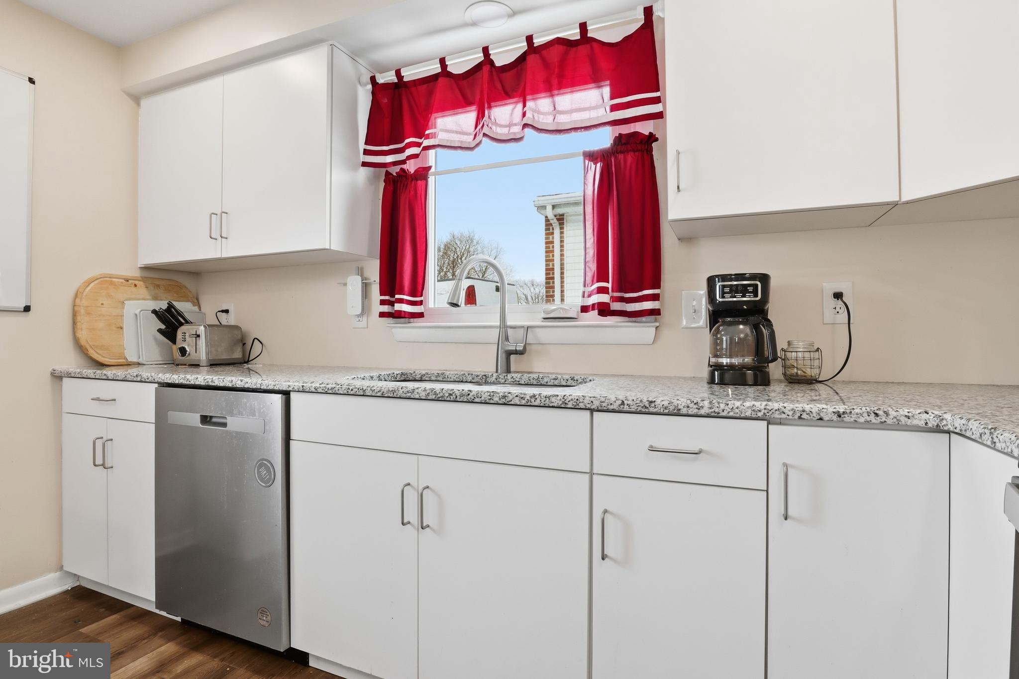 521 South Findlay Street York, PA 17402 - Photo 13 of 45 a kitchen with white cabinets and sink