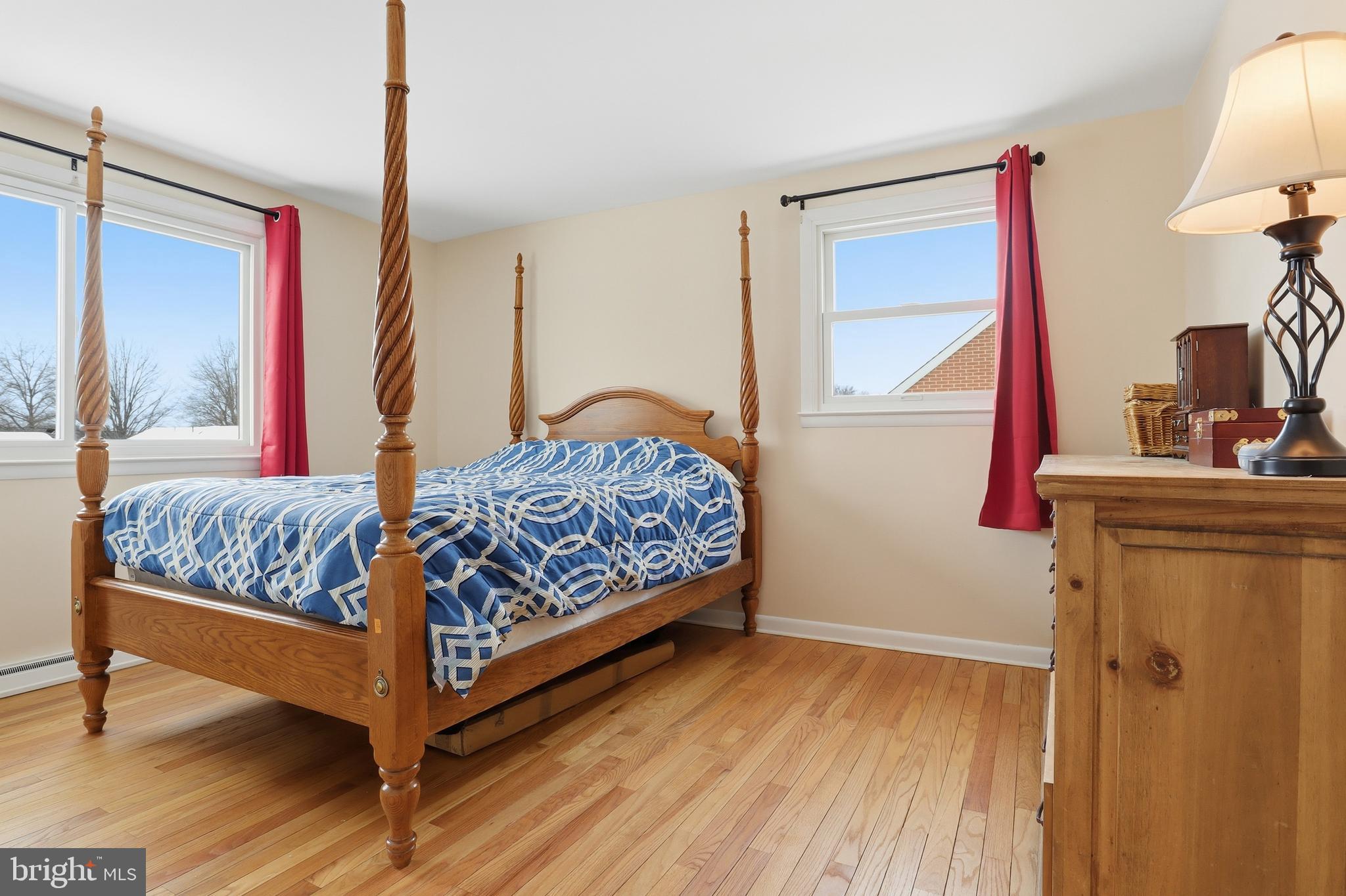 521 South Findlay Street York, PA 17402 - Photo 31 of 45 a bedroom with a bed and wooden floor