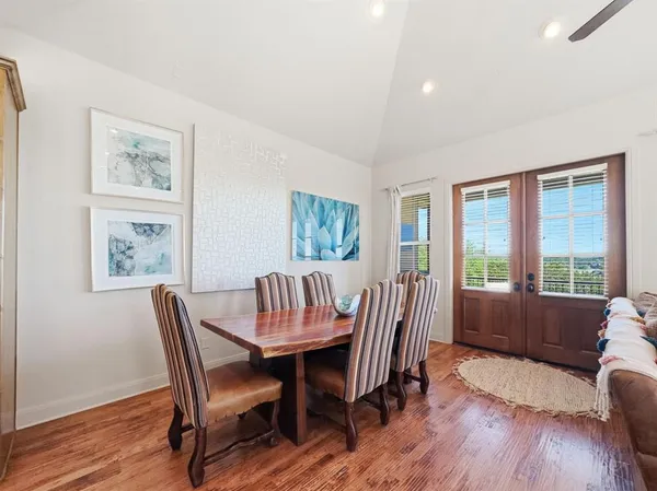 a view of a dining room with furniture window and wooden floor