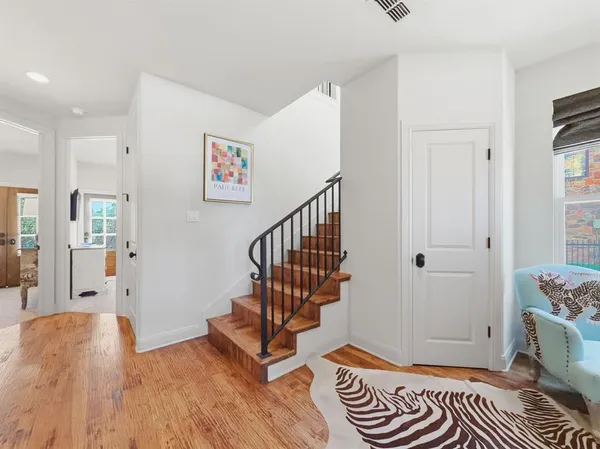 a view of entryway with wooden floor