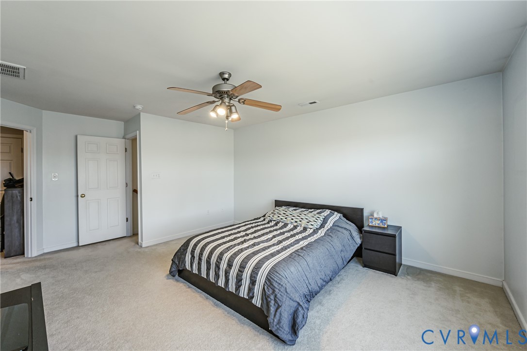 4070 Trisha Trail Midlothian, VA 23112 - Photo 27 of 40 Carpeted bedroom with ceiling fan and baseboards
