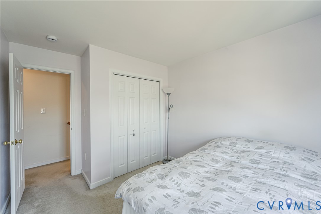 4070 Trisha Trail Midlothian, VA 23112 - Photo 38 of 40 Bedroom with light carpet and a closet