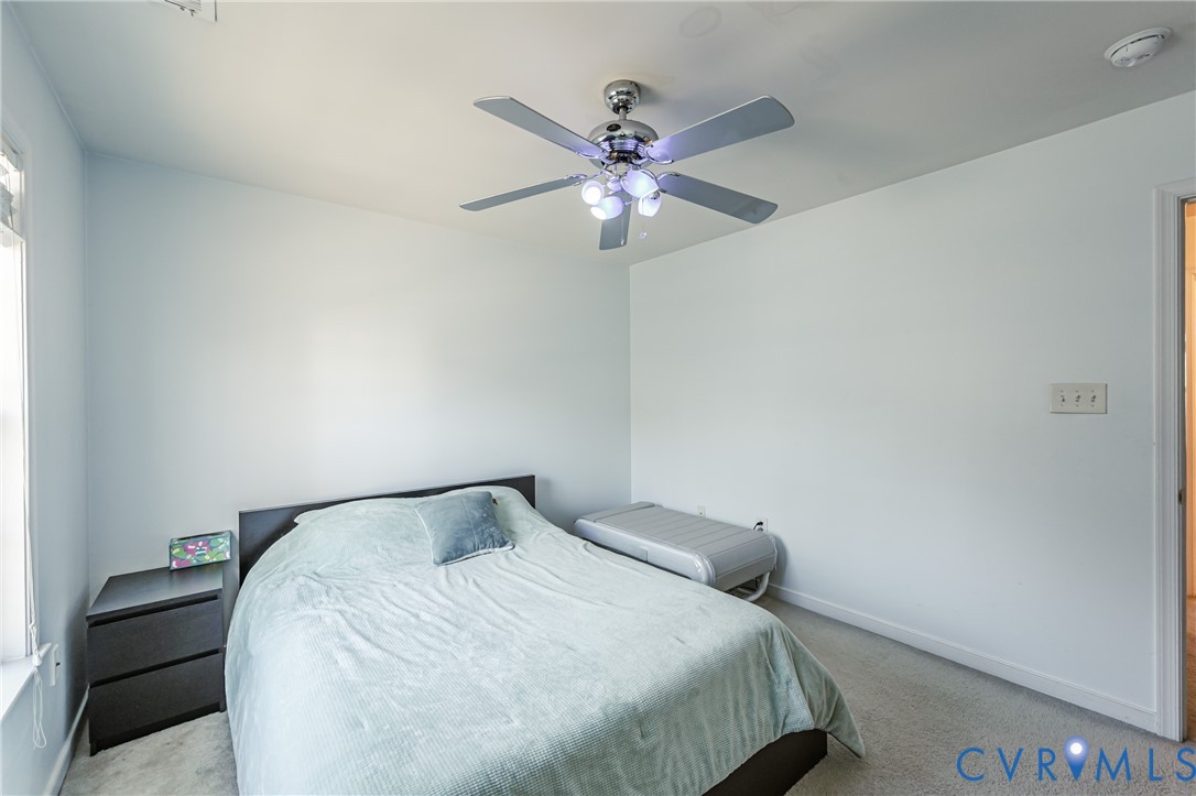 4070 Trisha Trail Midlothian, VA 23112 - Photo 40 of 40 Bedroom with light colored carpet and ceiling fan
