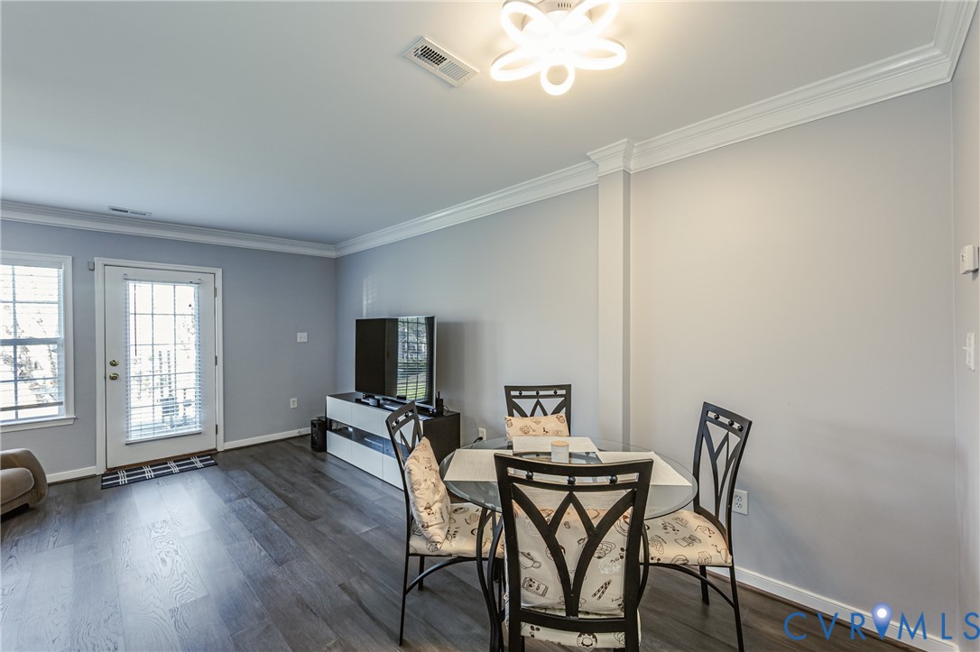 4070 Trisha Trail Midlothian, VA 23112 - Photo 7 of 40 Dining area featuring ornamental molding and dark