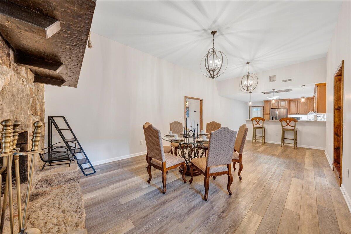 7415 Clear Fork Creek Road Bastian, VA 24314 - Photo 36 of 117 a view of a dining room with furniture wooden floor and a rug