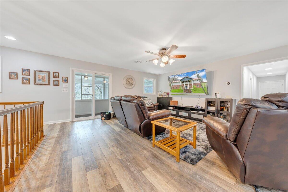 7415 Clear Fork Creek Road Bastian, VA 24314 - Photo 56 of 117 a living room with furniture two wooden floor and a window