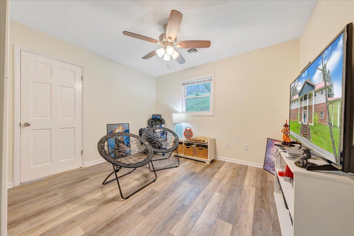 7415 Clear Fork Creek Road Bastian, VA 24314 - Photo 58 of 117 a living room with furniture and a flat screen tv