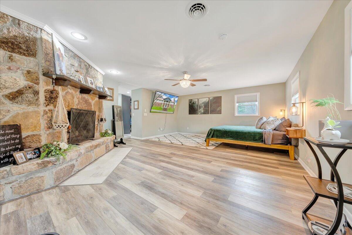 7415 Clear Fork Creek Road Bastian, VA 24314 - Photo 66 of 117 a bedroom with furniture and a wooden floor