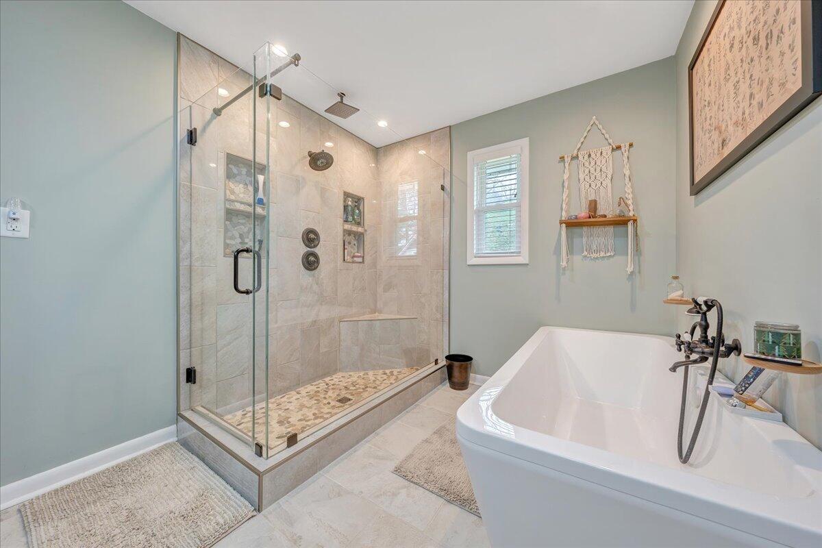 7415 Clear Fork Creek Road Bastian, VA 24314 - Photo 70 of 117 a bathroom with a tub a sink and a shower