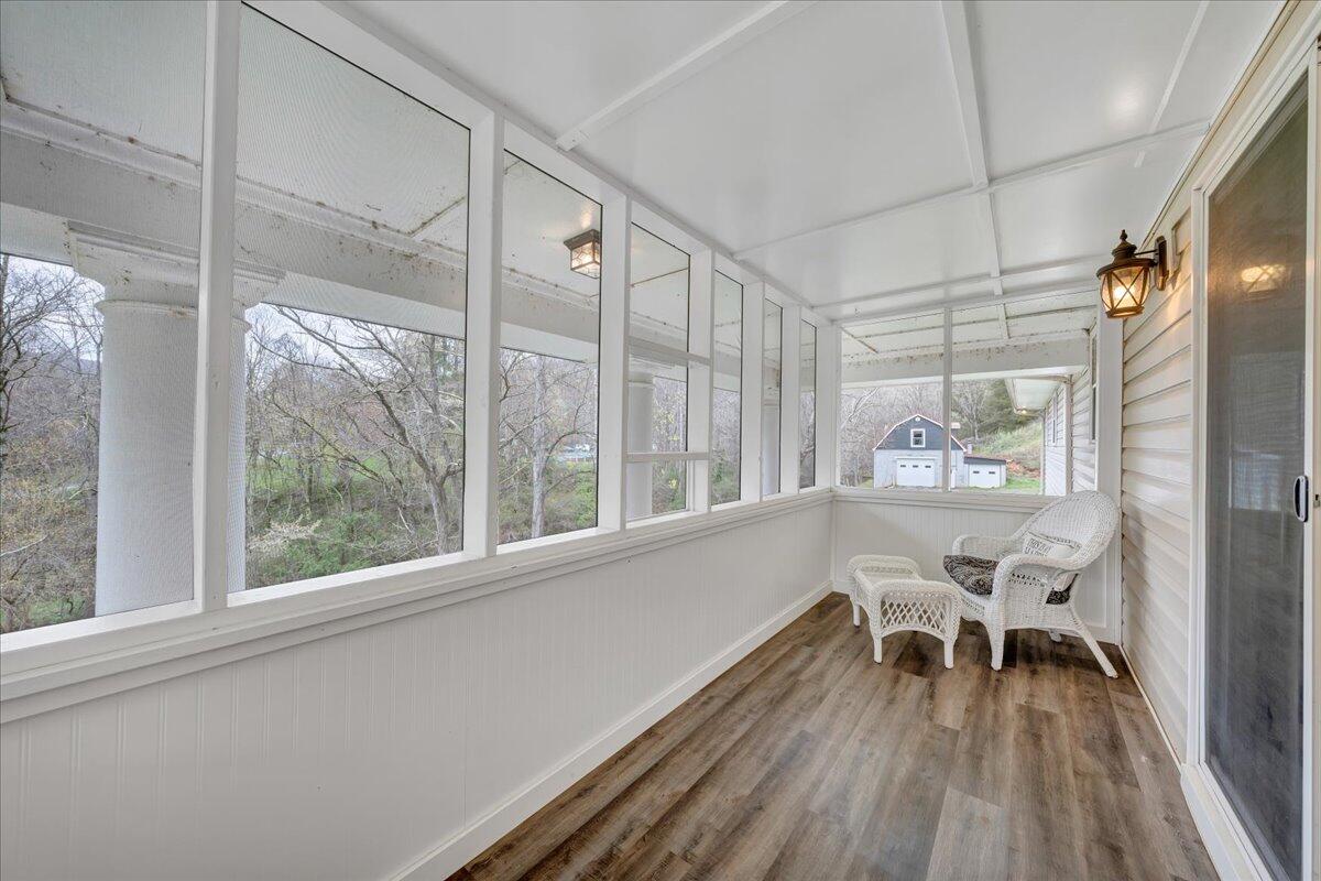 7415 Clear Fork Creek Road Bastian, VA 24314 - Photo 73 of 117 a dining room with wooden floor and a window