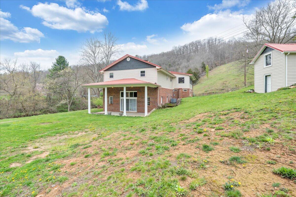 7415 Clear Fork Creek Road Bastian, VA 24314 - Photo 86 of 117 a front view of a house with a yard