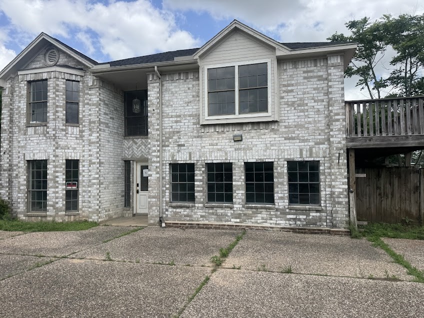 5407 Victoria Drive Rosharon, TX 77583 - Photo 2 of 23 a front view of a house with a yard and garage