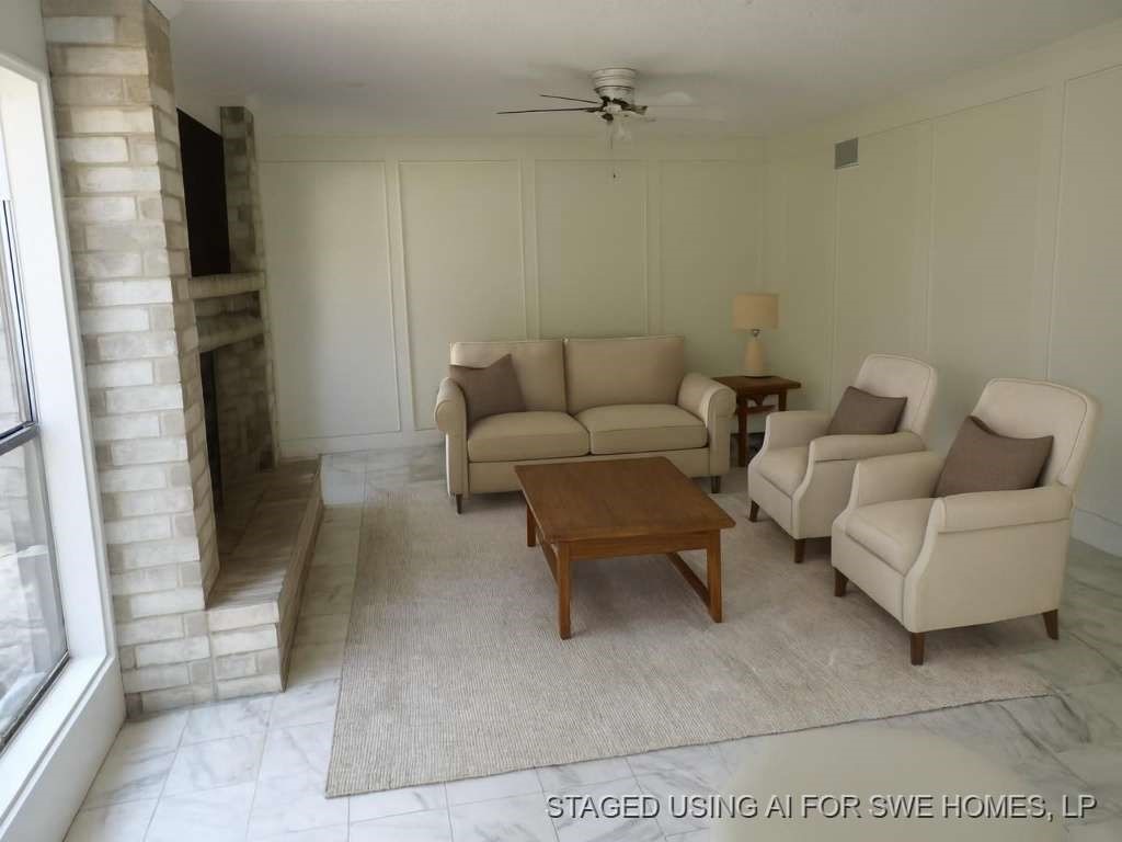 5407 Victoria Drive Rosharon, TX 77583 - Photo 7 of 23 a living room with furniture and a fireplace