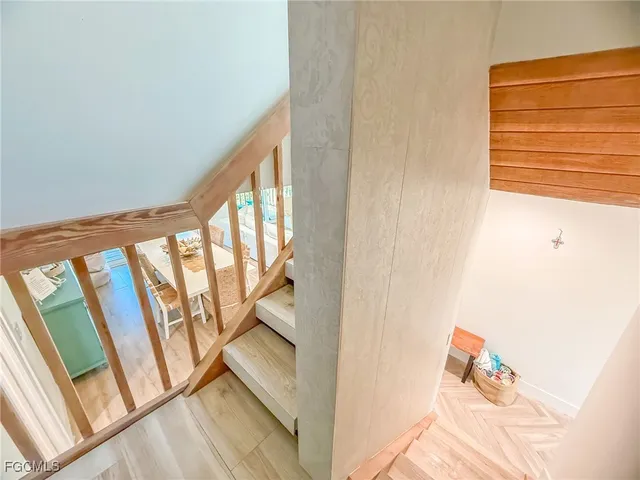 a utility room with dryer washer and a view of living room