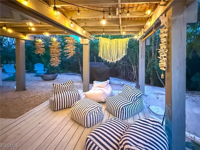 an aerial view of a houses with a lake