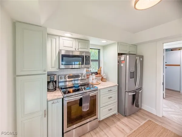 a kitchen with a stove and a sink