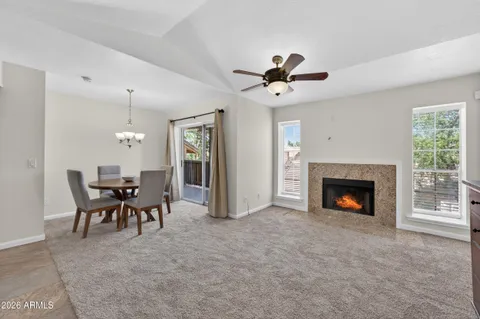 a view of a livingroom with furniture and a fireplace