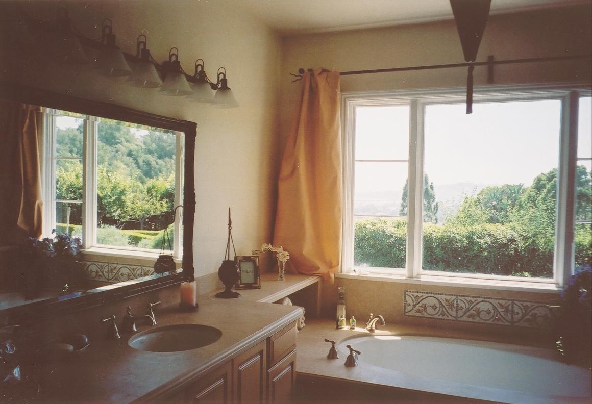 161 Rametto Road Santa Barbara, CA 93108 - Photo 2 of 8 a bathroom with a tub a sink and a large window