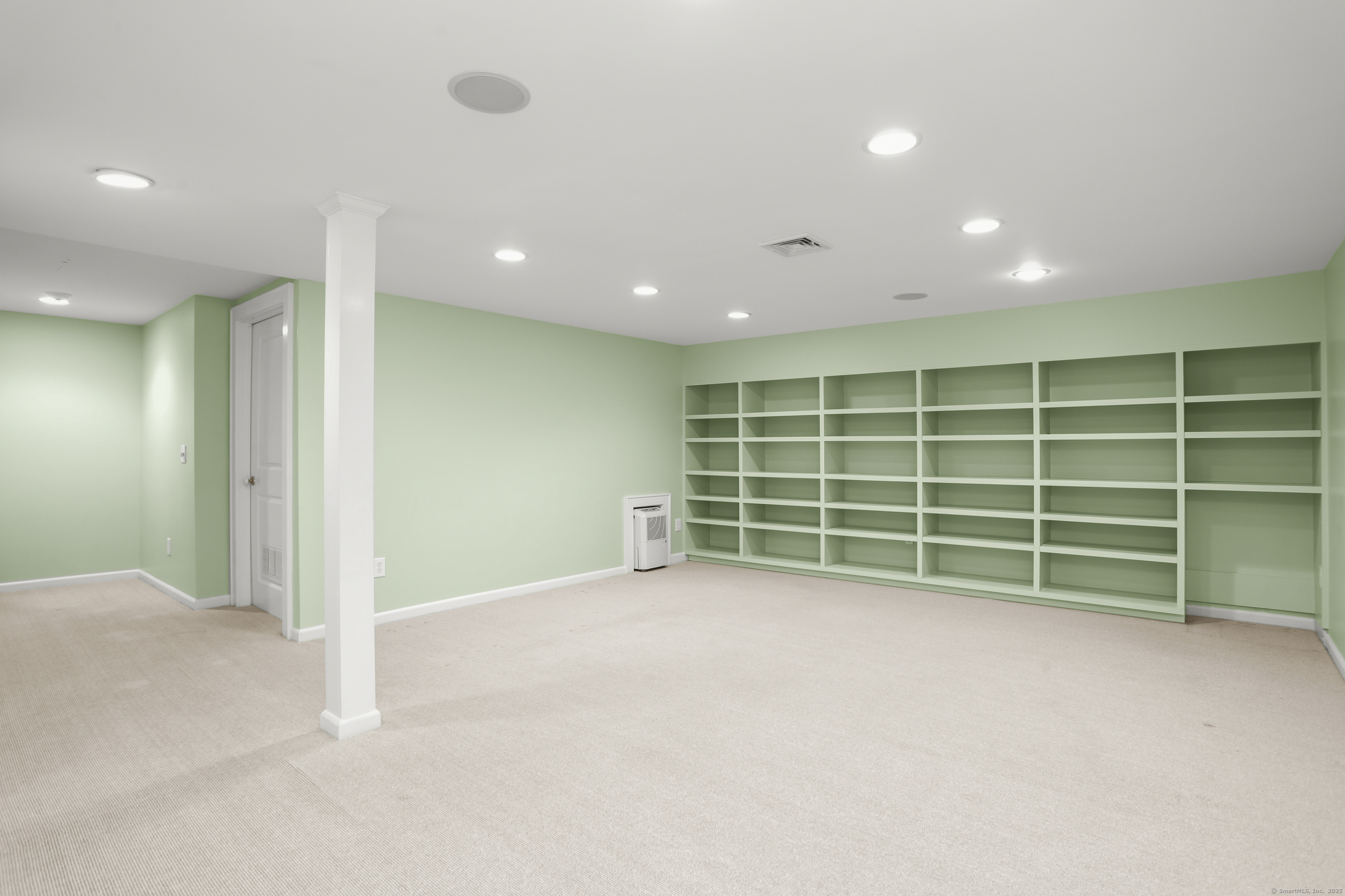 112 Hillspoint Road Westport, CT 06880 - Photo 30 of 36 Lower Level - Recreation/Playroom. The carpet has been replaced with engineering wood.