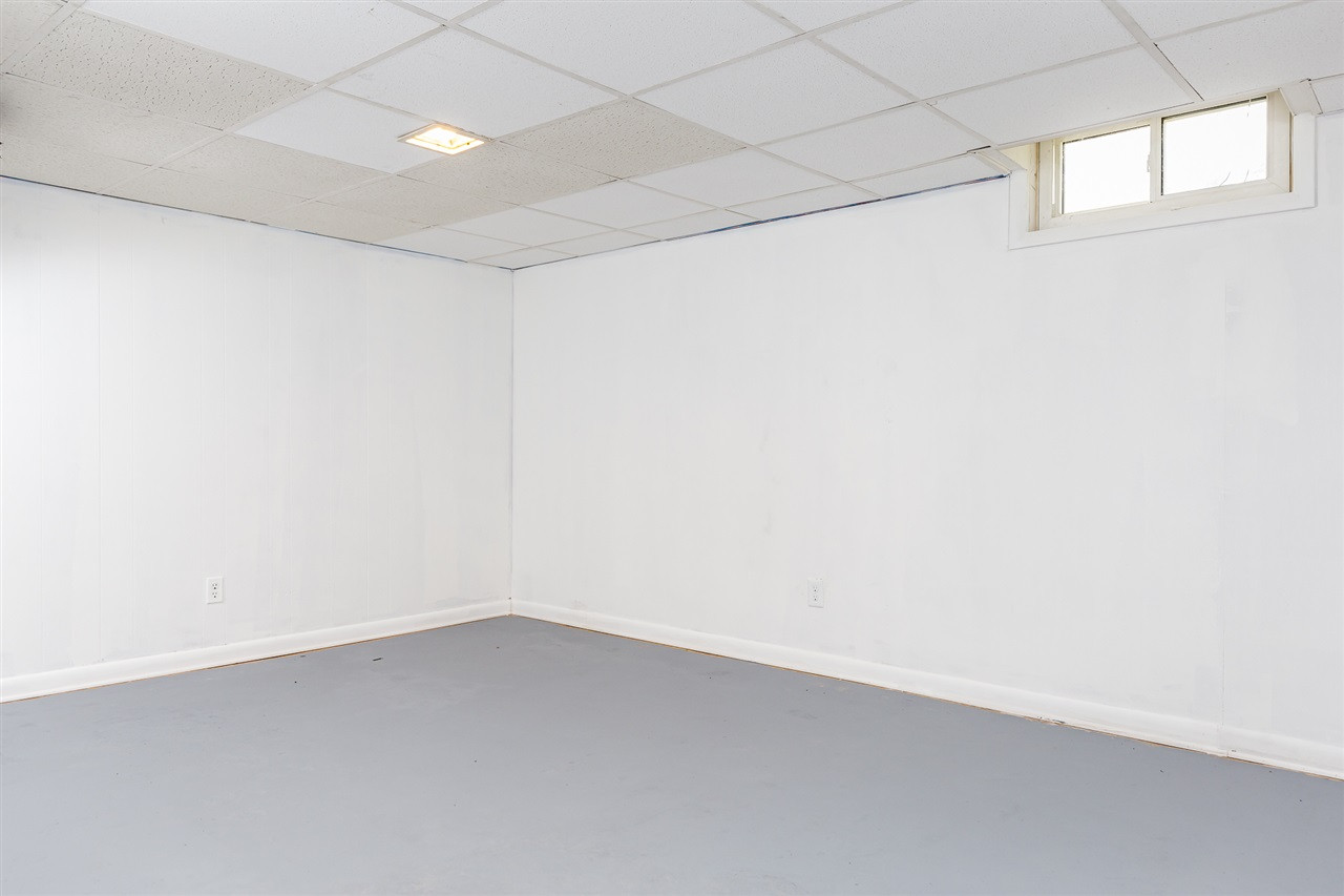 1318 Kent Road Raleigh, NC 27606 - Photo 20 of 28 Lower level Front Bedroom. Window not to code to allow fro egress