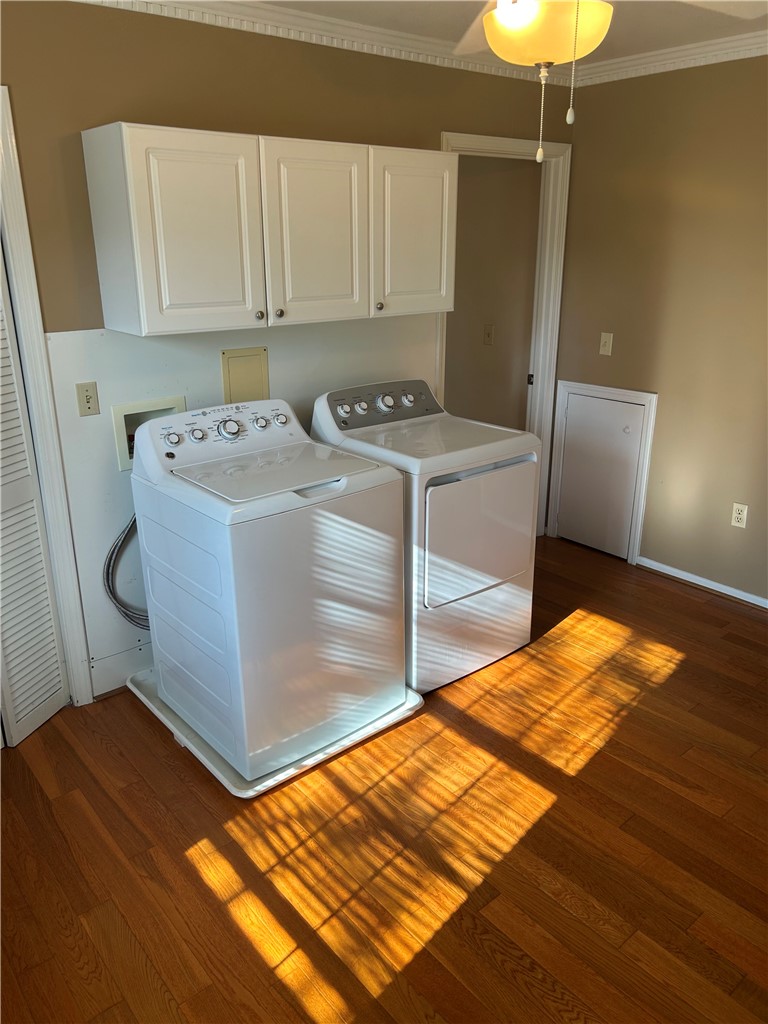 110 North Broad Street Pendleton, SC 29670 - Photo 20 of 36 Ample cabinetry and hardwood flooring enhance this practical laundry space.