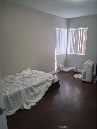 a bedroom with bed and window