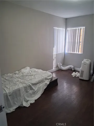 a bedroom with bed and window