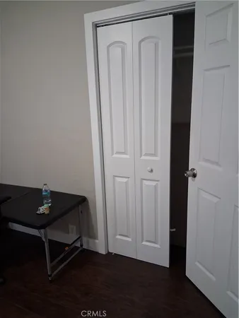 a room with a table and wooden floor