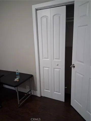 a room with a table and wooden floor