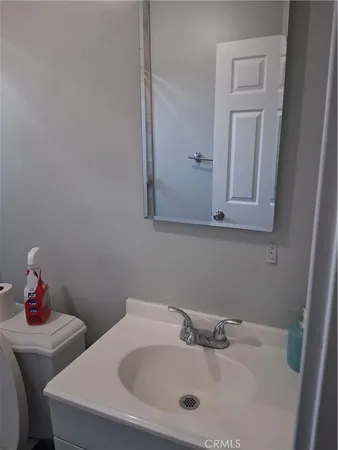 a bathroom with a sink and a vanity