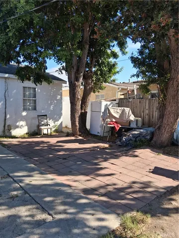 a view of street with large trees
