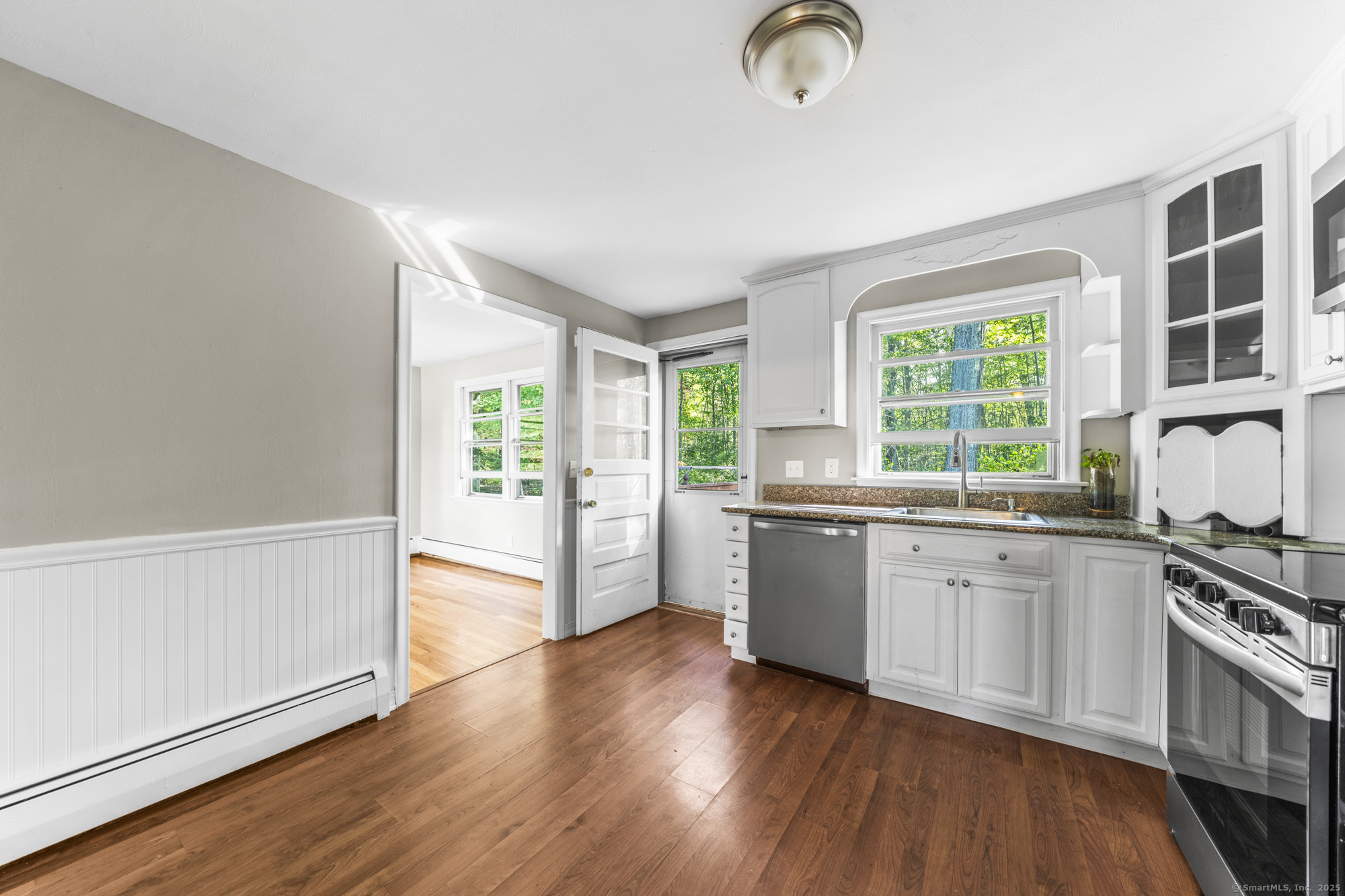 779 Bridge Street Suffield, CT 06078 - Photo 12 of 35 a kitchen with stainless steel appliances granite countertop a stove a sink and a refrigerator
