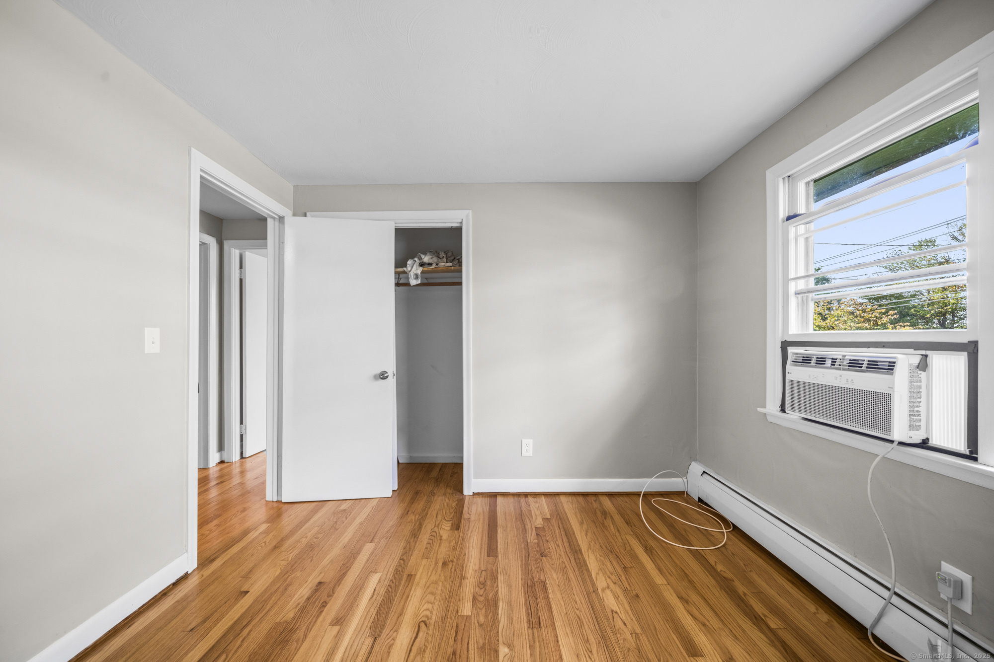 779 Bridge Street Suffield, CT 06078 - Photo 18 of 35 a view of empty room with wooden floor and fan