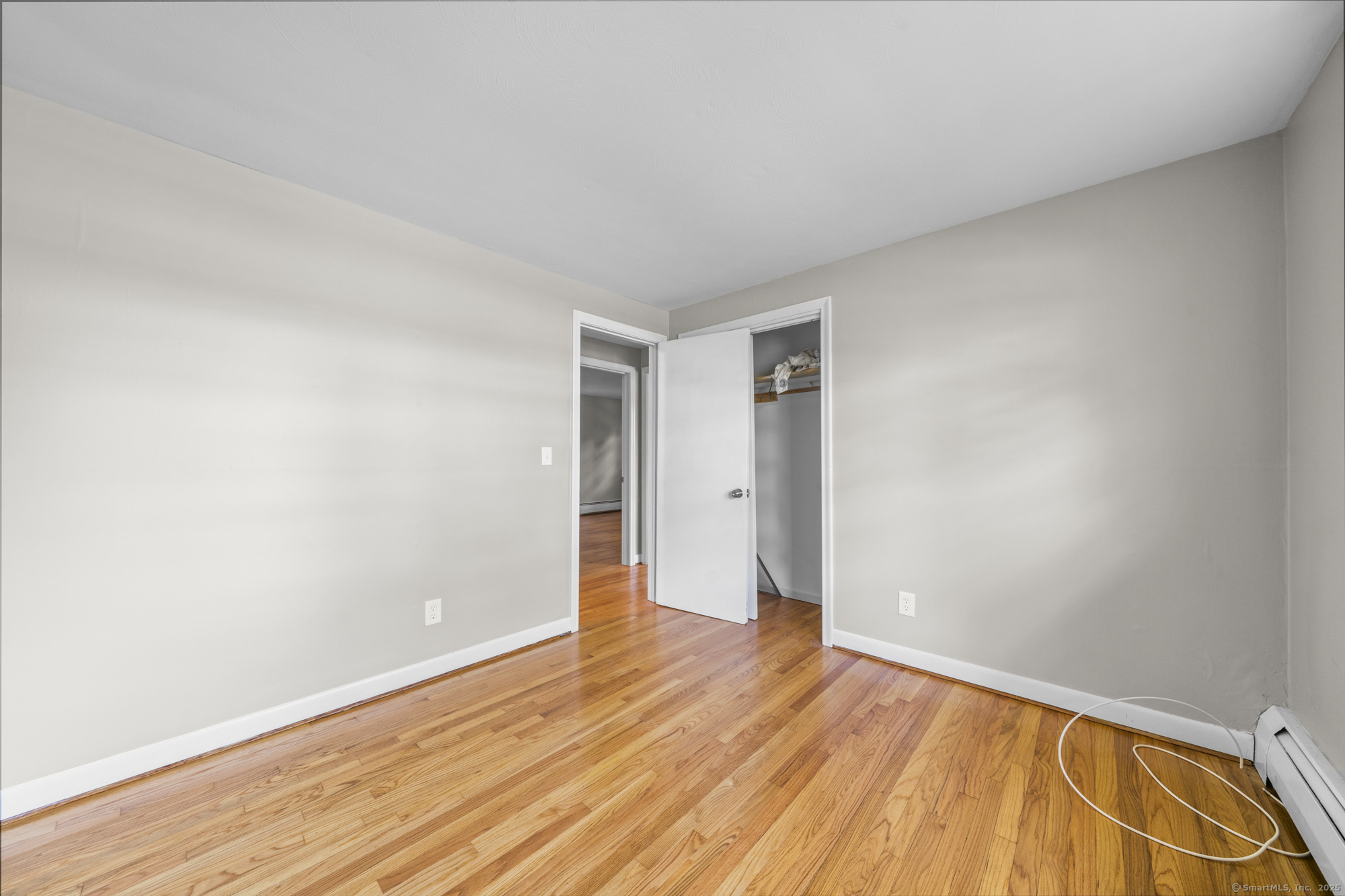 779 Bridge Street Suffield, CT 06078 - Photo 19 of 35 a view of an empty room with wooden floor