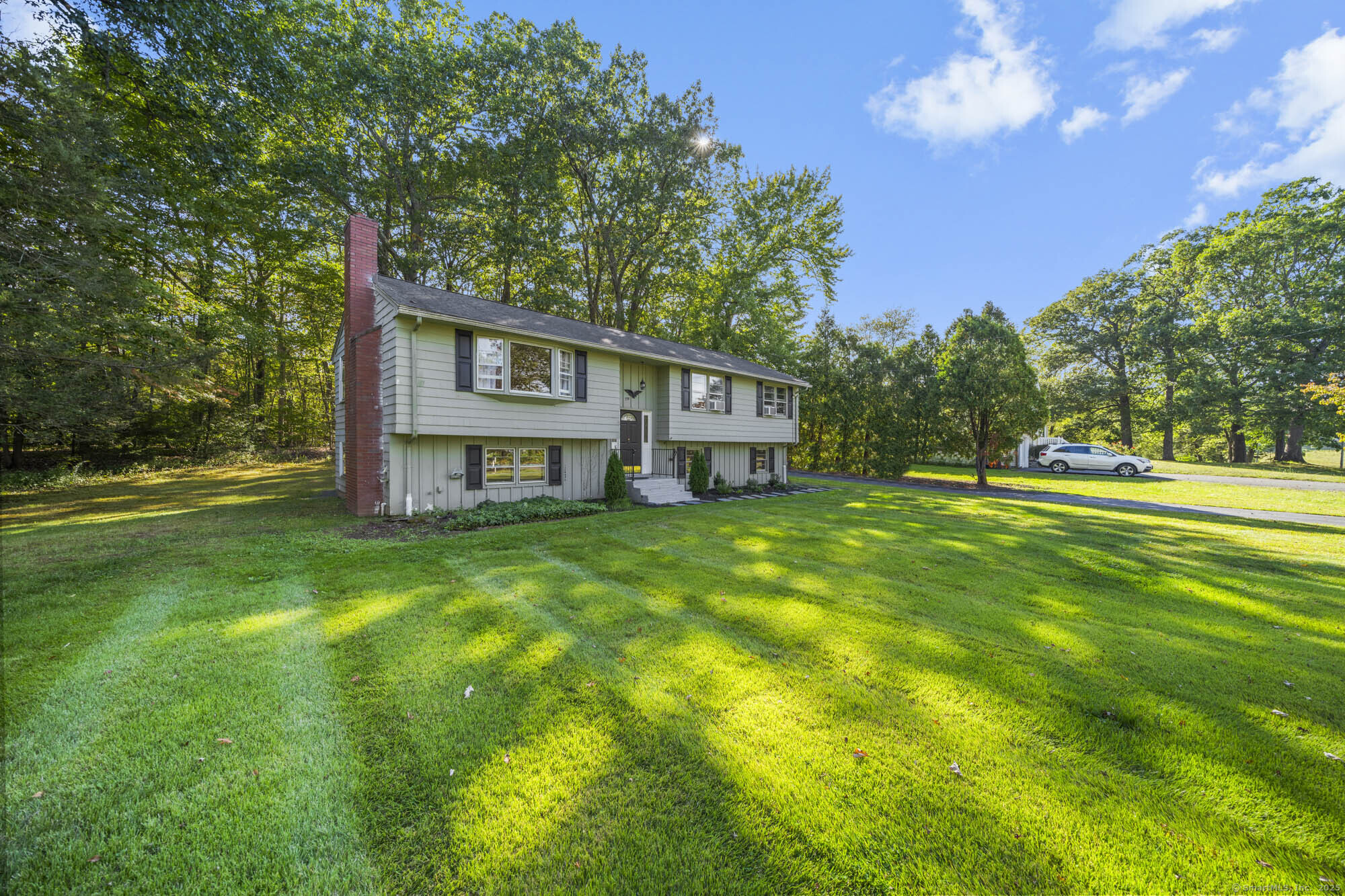 779 Bridge Street Suffield, CT 06078 - Photo 2 of 35 a view of a house with a big yard