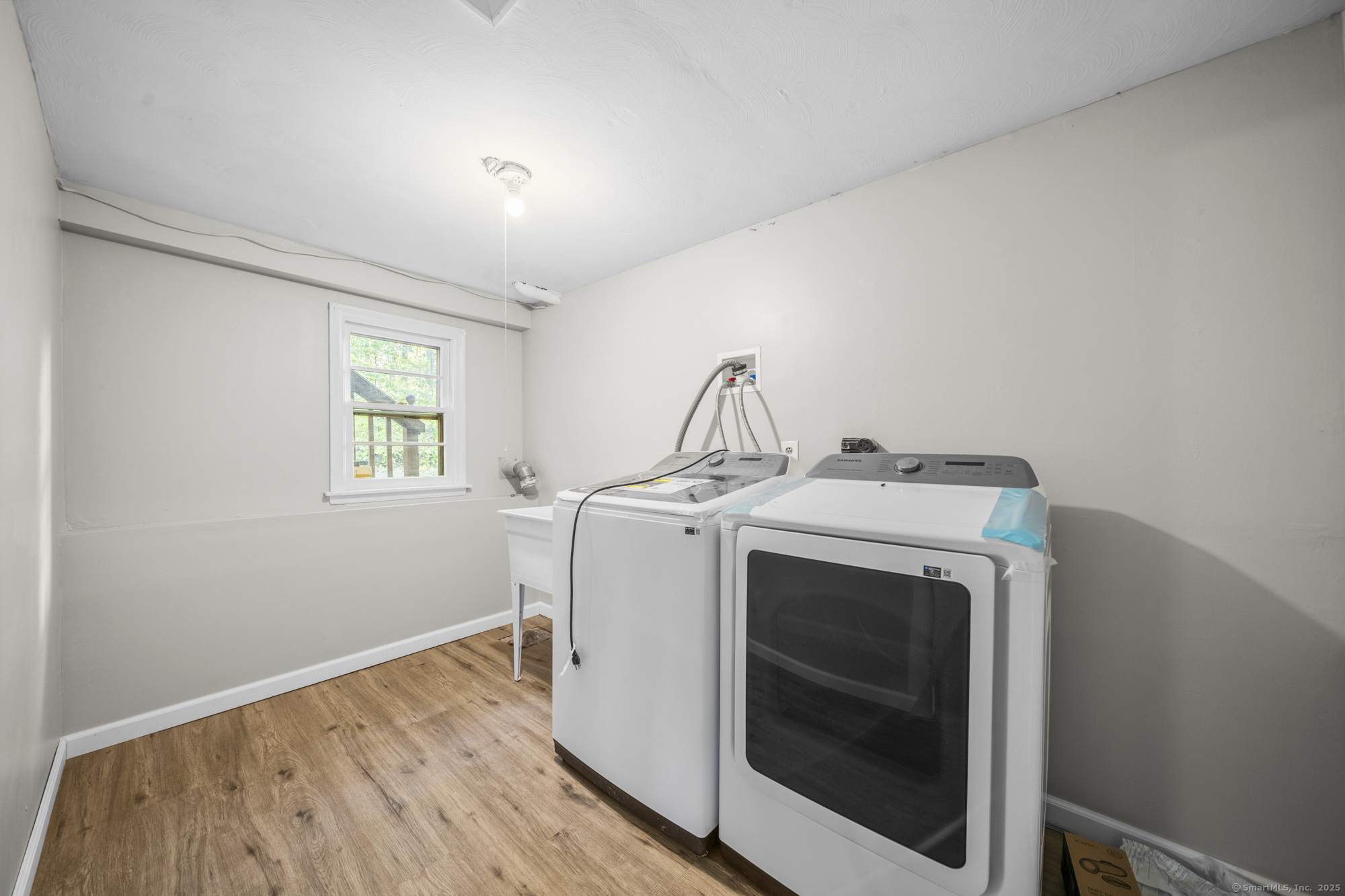 779 Bridge Street Suffield, CT 06078 - Photo 29 of 35 a utility room with dryer and washer