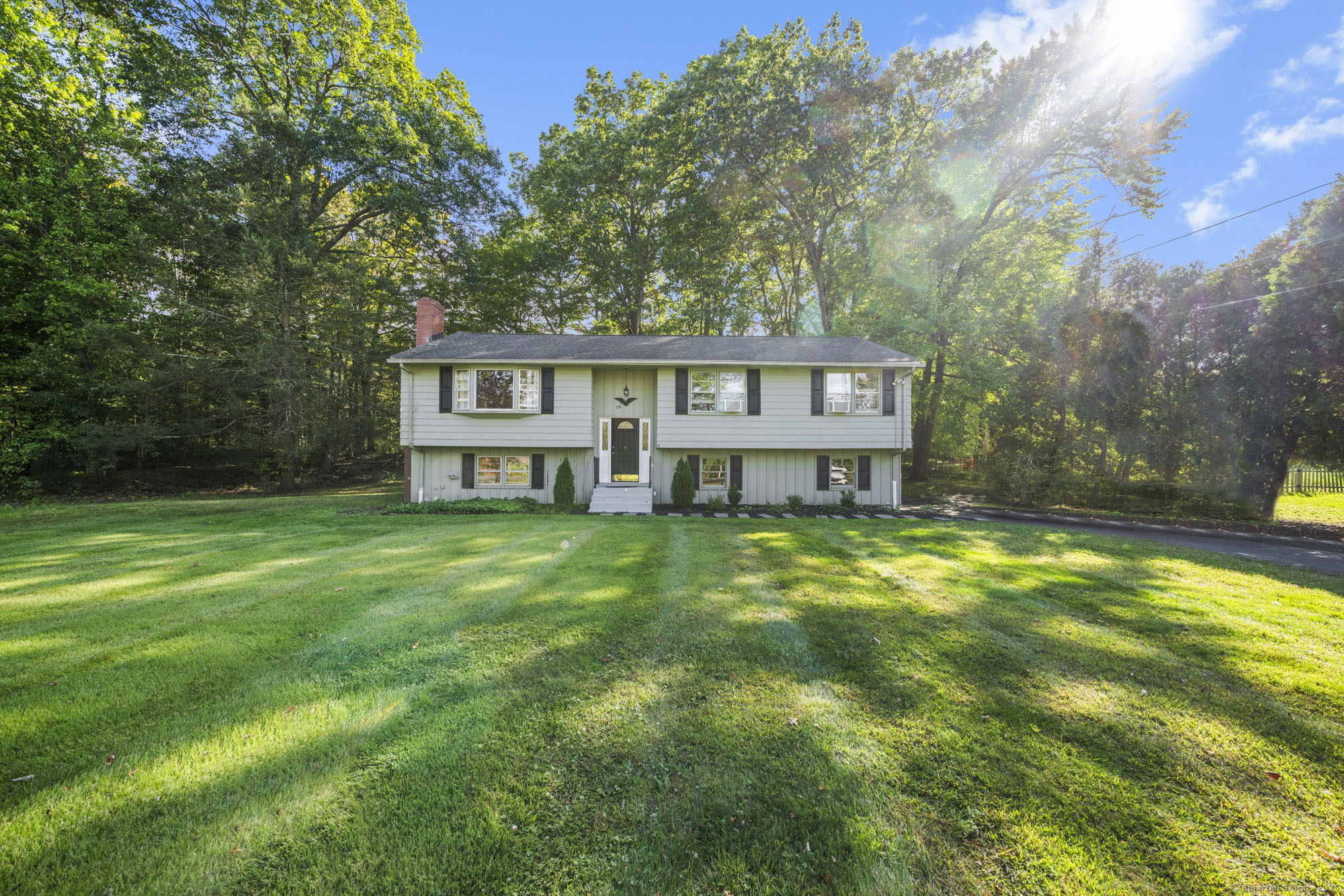 779 Bridge Street Suffield, CT 06078 - Photo 3 of 35 a view of a house with a yard table and chairs