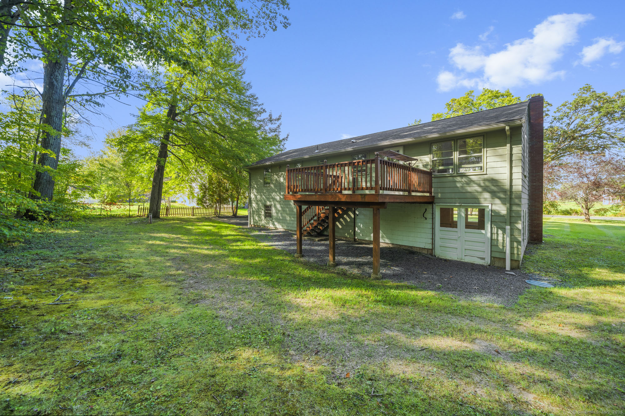 779 Bridge Street Suffield, CT 06078 - Photo 32 of 35 a view of a backyard with a garden and entertaining space